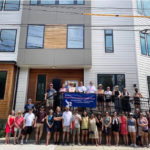 Photo credit: Somerville Community Land Trust board and volunteers in front of 7 Summer Street. Photo courtesy of the Somerville Community Land Trust.